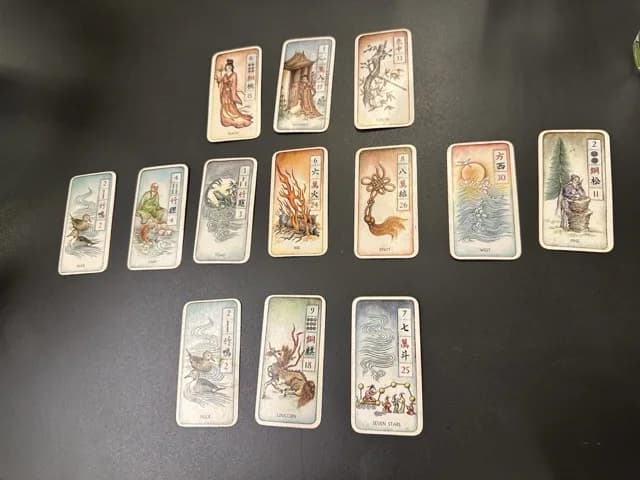 Mahjong tiles alongside tarot cards